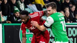 Aberdeen players celebrate an important win over Hibernian.